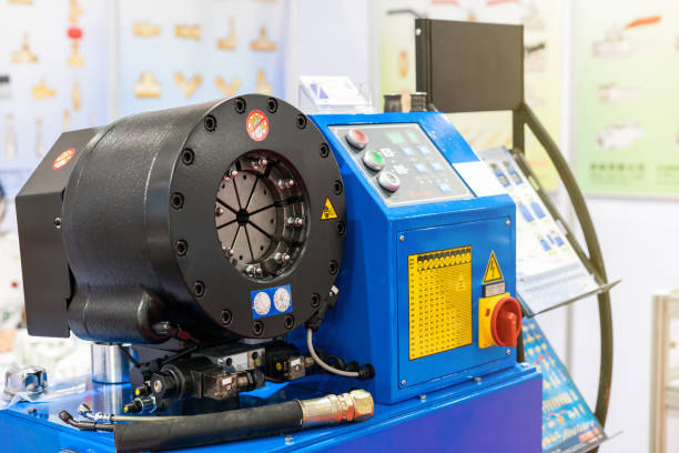 istockphoto-1140945173-612×612 close up crimp head of automatic hydraulic rubber hose crimping machine for industrial